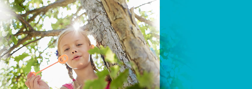 Child blowing bubbles