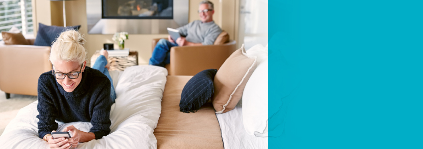 Woman looking at phone smiling